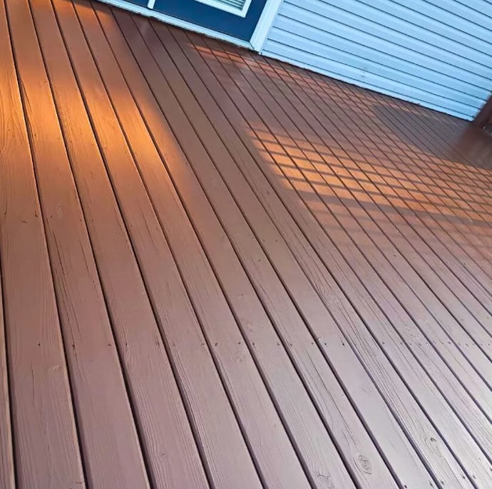 Freshly stained warm brown wood deck boards in Decatur, Illinois