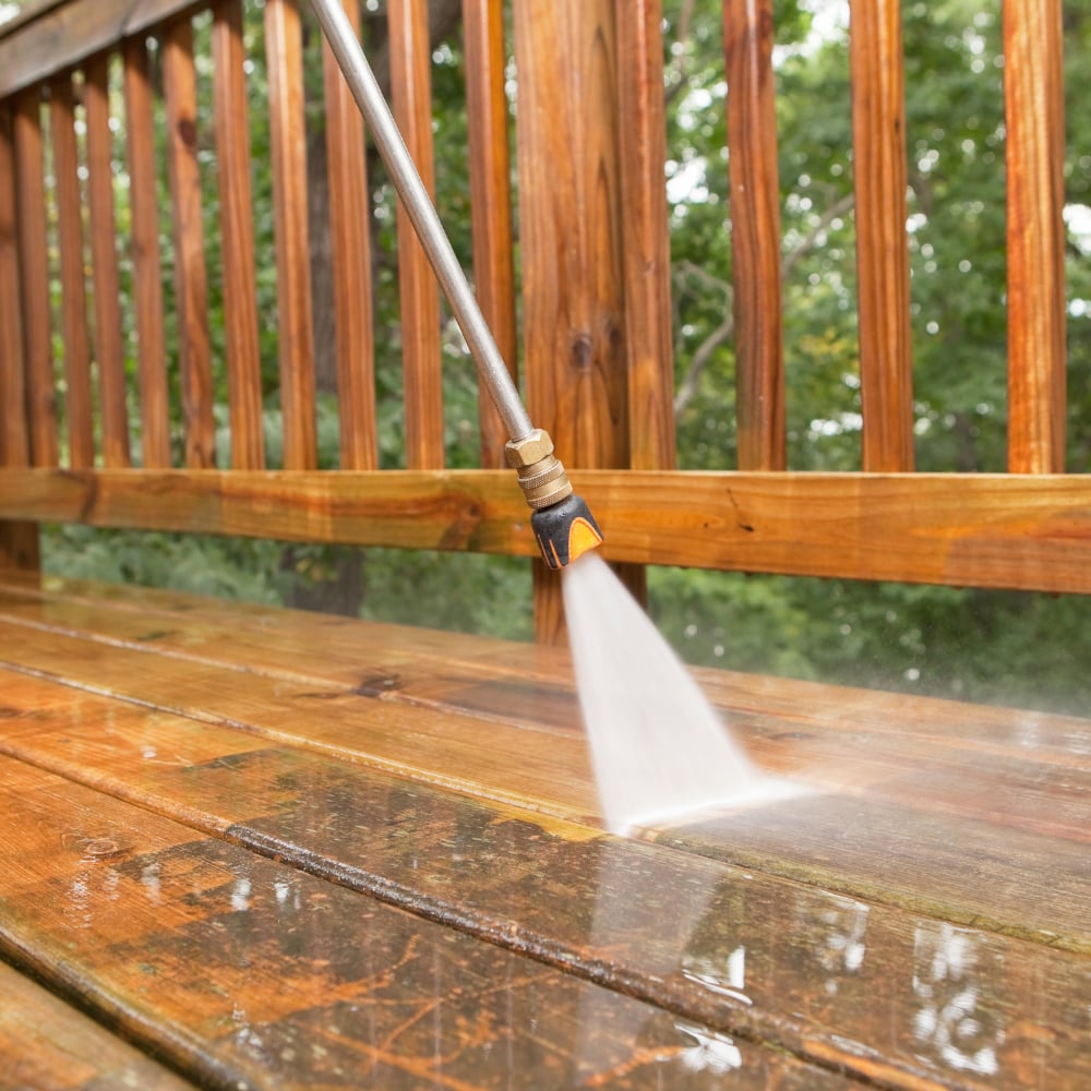 Power washing wood deck with pressure washer near Decatur Illinois