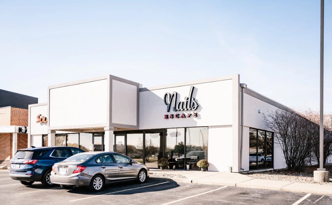 Commercial painting Springfield Illinois — Clean Cut Painting freshly painted white commercial storefront building